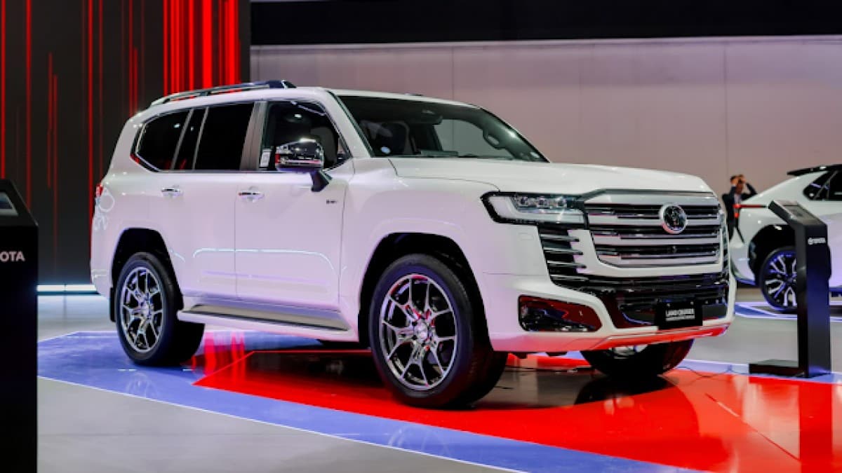 2026 Toyota Land Cruiser 300 HEV in silver on a showroom floor