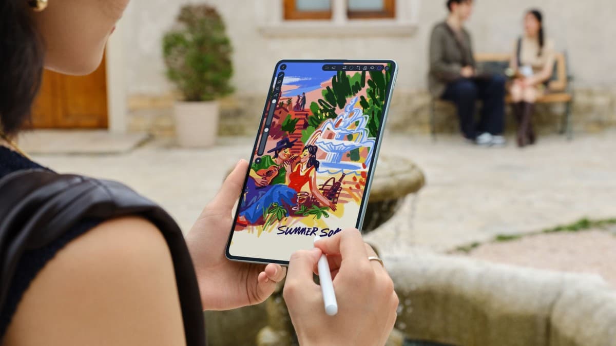 HUAWEI MatePad Mini compact tablet held in one hand showing its thin bezels
