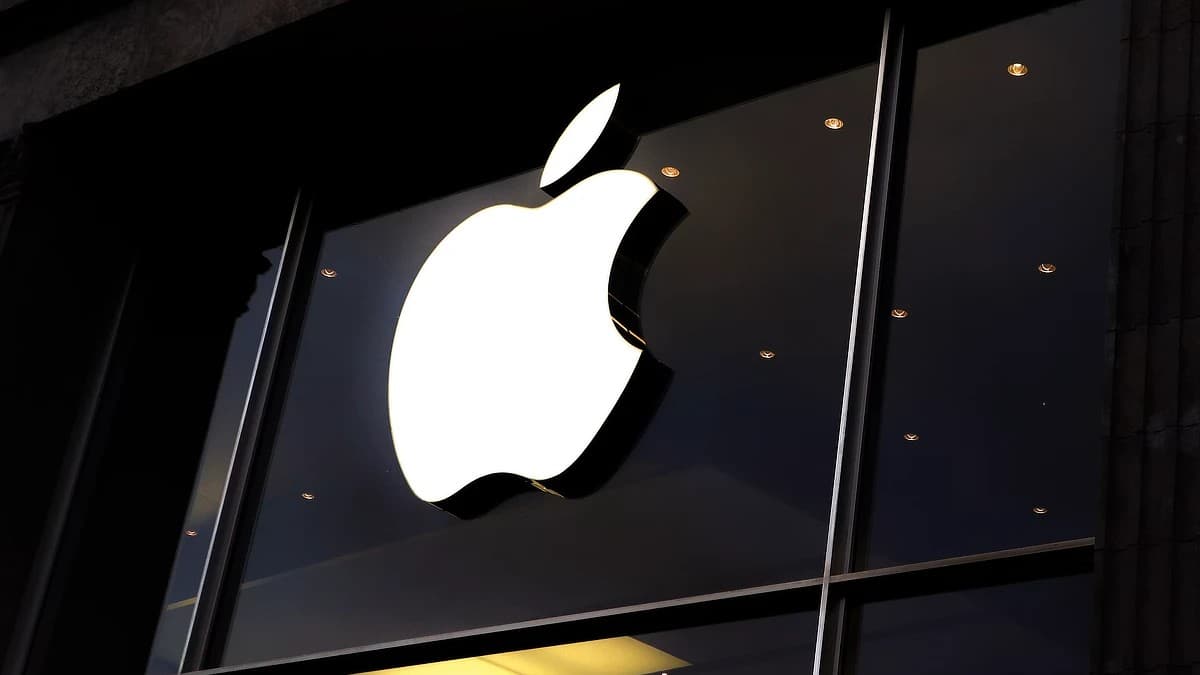 Apple Store exterior with the iconic Apple logo illuminated