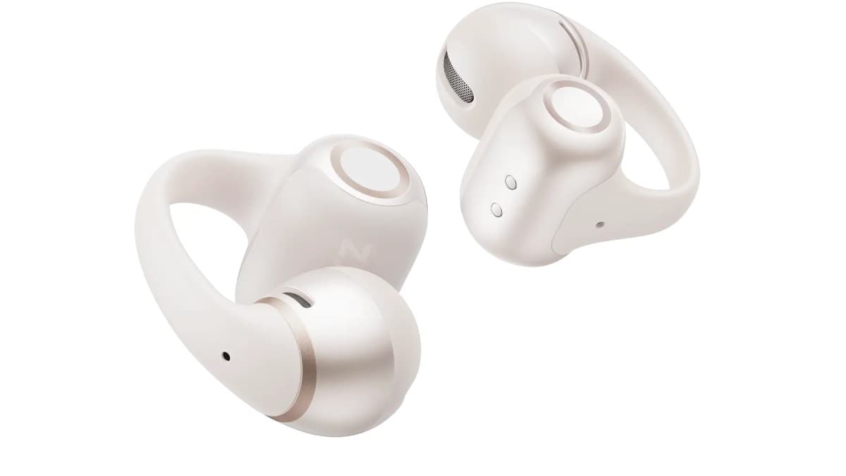 Shokz OpenDots 2 clip-on open-ear earbuds in white beside their charging case