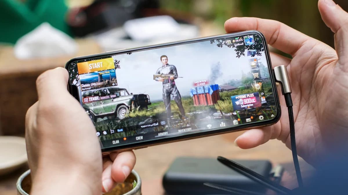 Person playing a mobile game on a smartphone