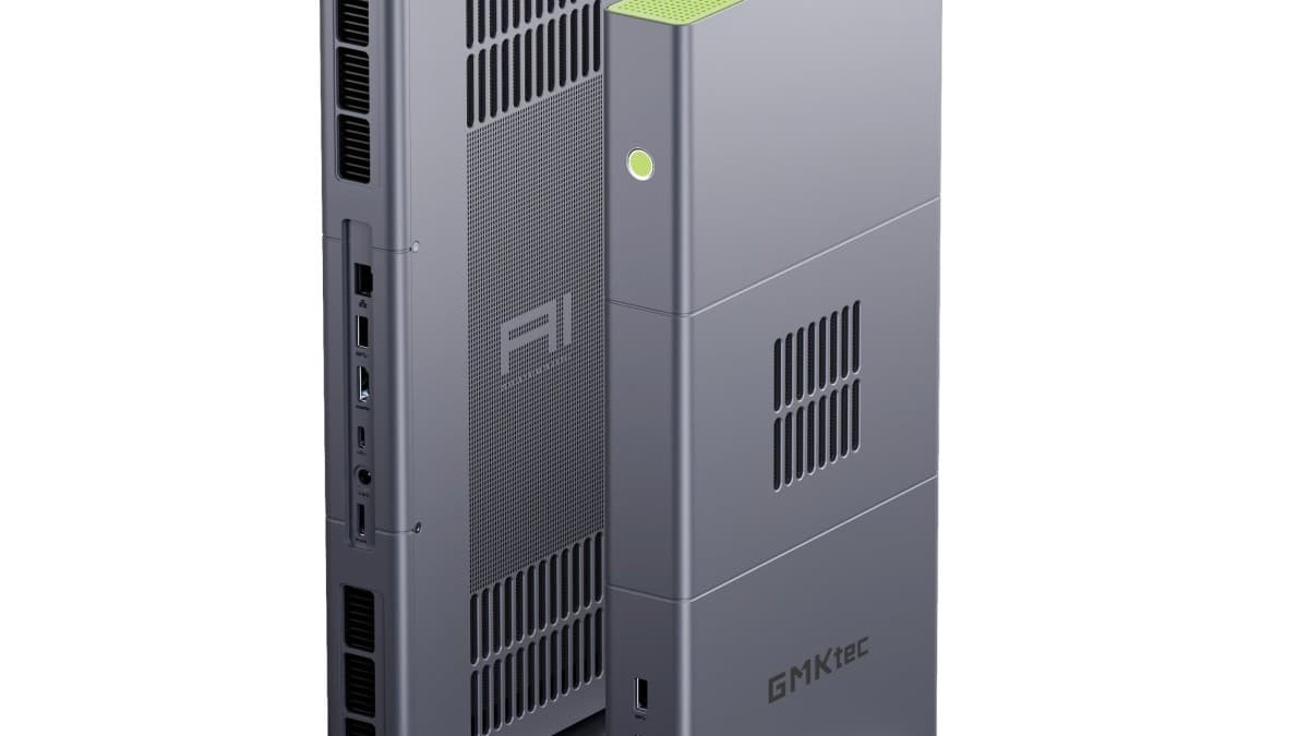 GMKtec EVO-X3 mini PC, a tall gray metal tower with green accents and triple cooling fans