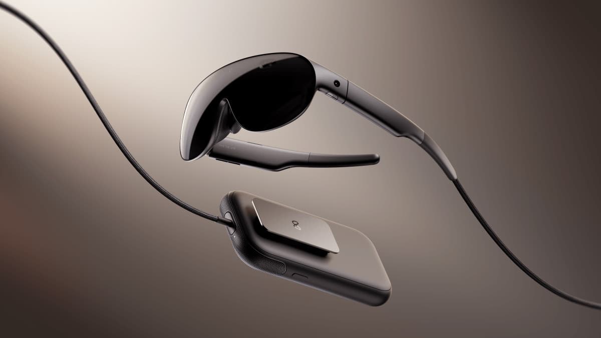 Meta VR Glasses and their pocket computing puck on a dark background